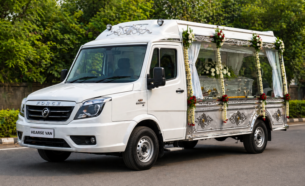 Decorated hearse van with floral arrangements for dignified funeral transport
